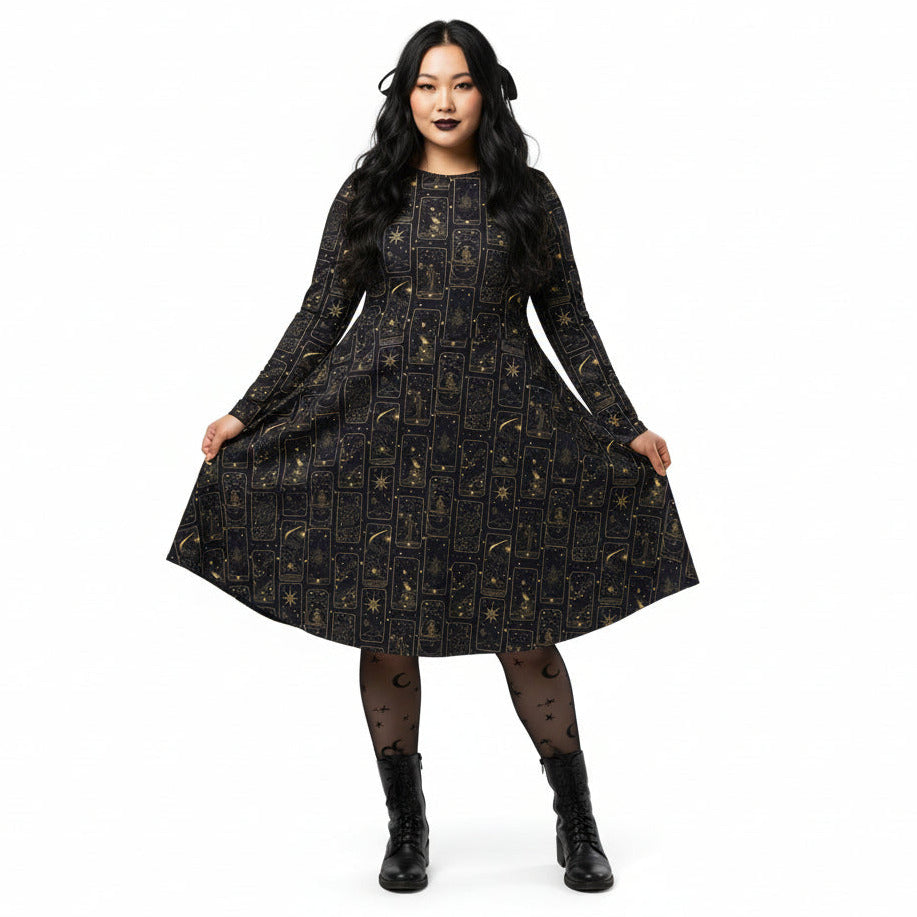 Woman wearing a black celestial tarot card print dress on a white background