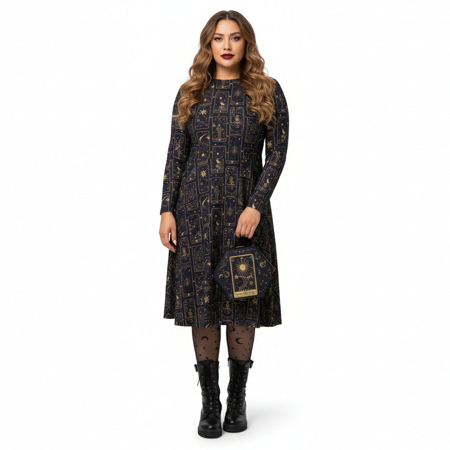 Woman wearing a celestial tarot card print dress holding a matching bag on a white background