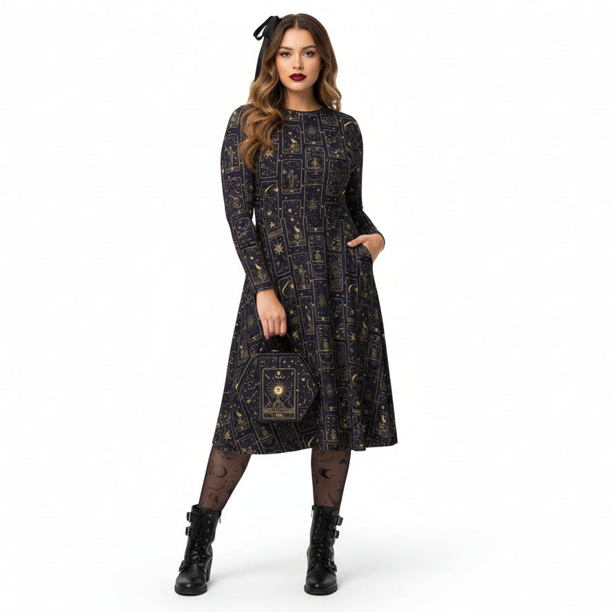 Woman wearing a black celestial tarot card print dress on a white background