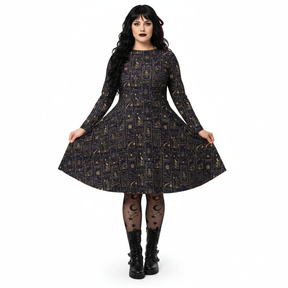 Woman wearing a black celestial tarot card print dress on a white background