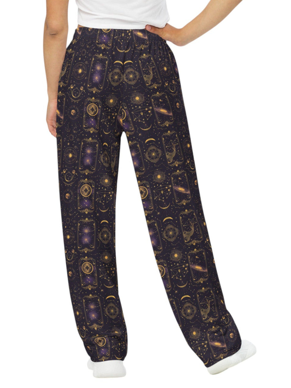 Woman wearing Whimsigoth Tarot Card Celestial wide leg lounge pants with sun moon stars pattern and side pockets.