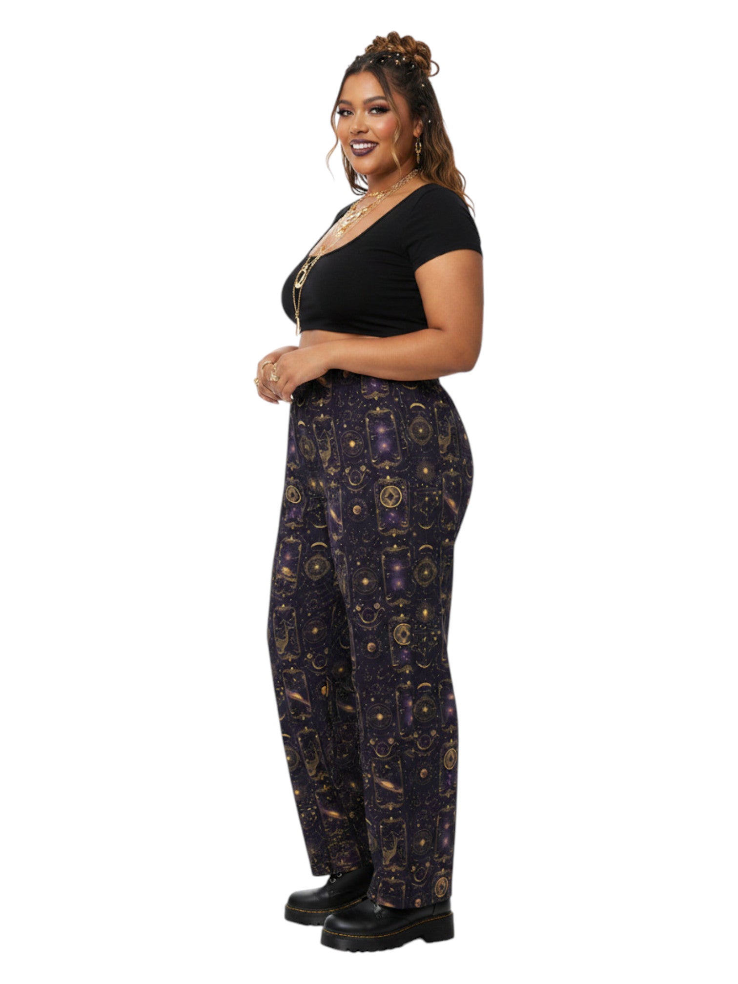 Plus-size model wearing Whimsigoth Tarot Card Celestial wide leg lounge pants with sun moon stars pattern and side pockets.
