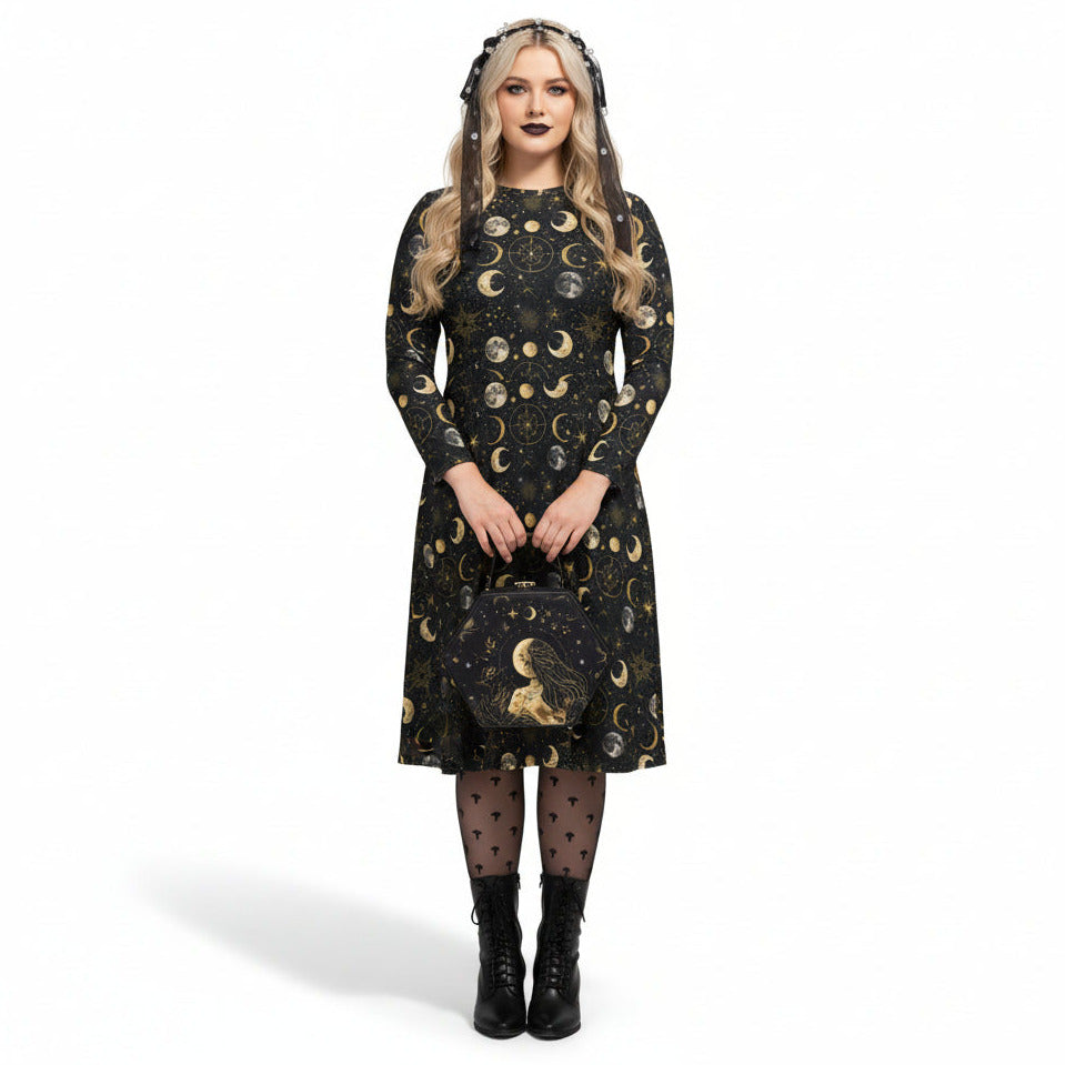 Woman wearing a black dress with gold moon phases on a white background
