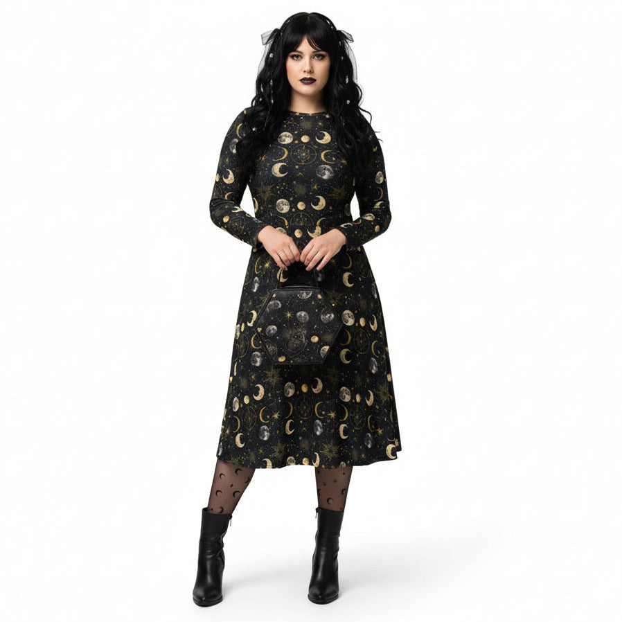 Woman wearing a black dress with gold moon phase pattern on a white background