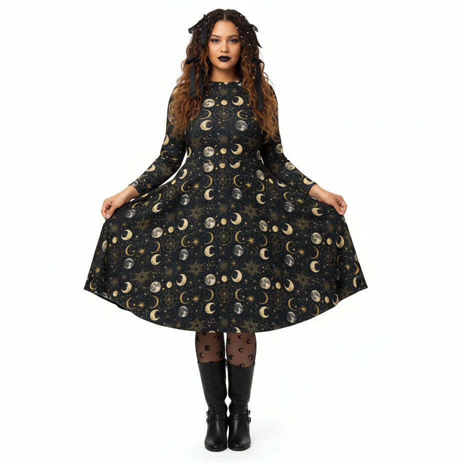 Woman wearing a black dress with celestial moon phase print on a white background