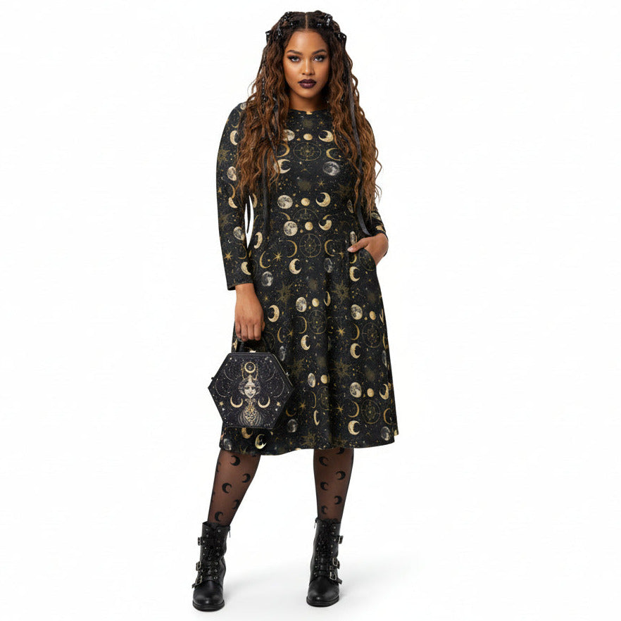 Woman wearing a black dress with celestial moon phase print on a white background