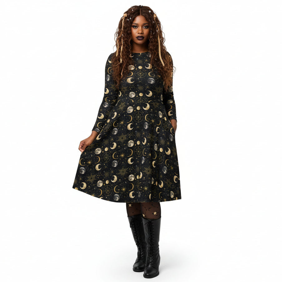 Woman wearing a black dress with celestial moon phase print on a white background