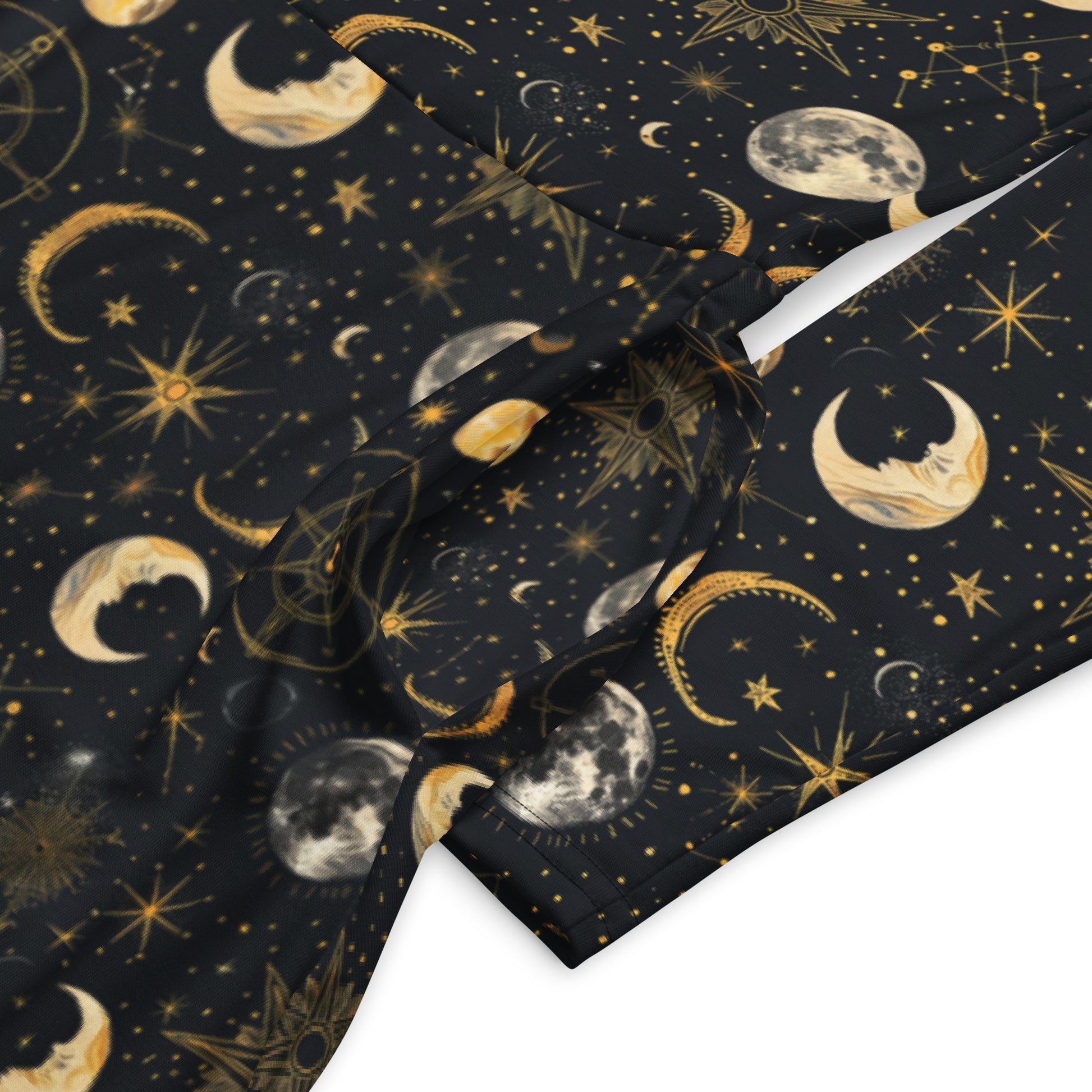 dress with celestial pattern featuring moons, stars, and constellations on a dark background.