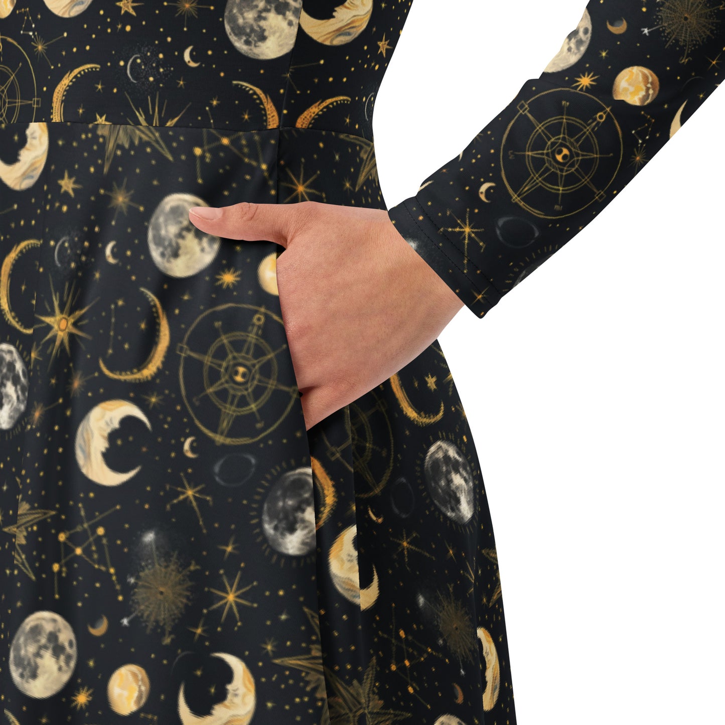 Dress with celestial moon phase print featuring moons, stars, and geometric designs on a black background.
