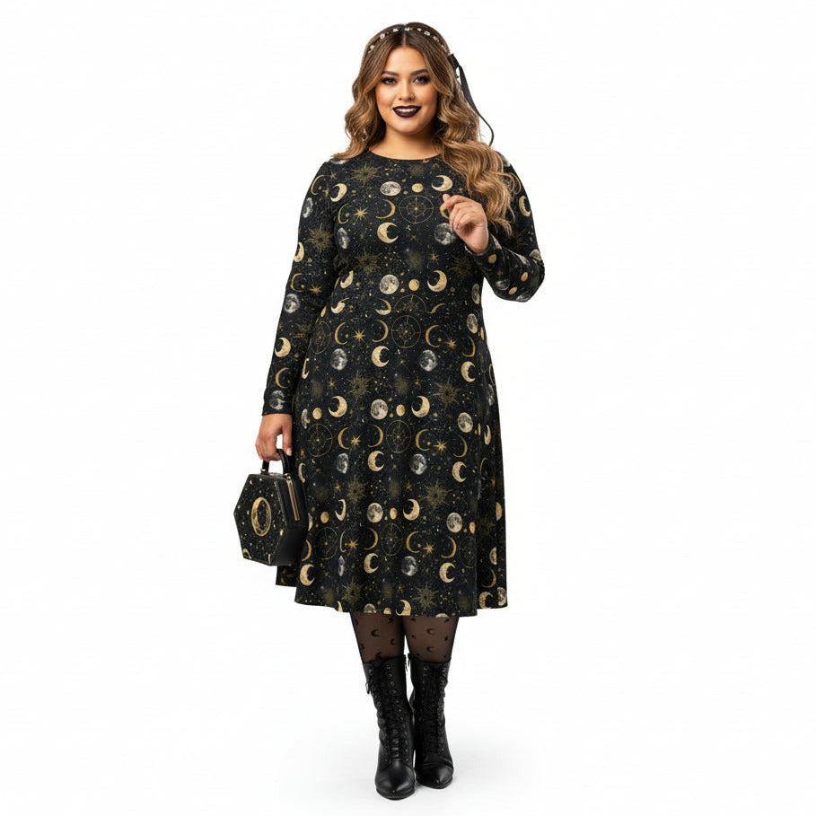 Woman wearing a black dress with moon phase pattern on a white background