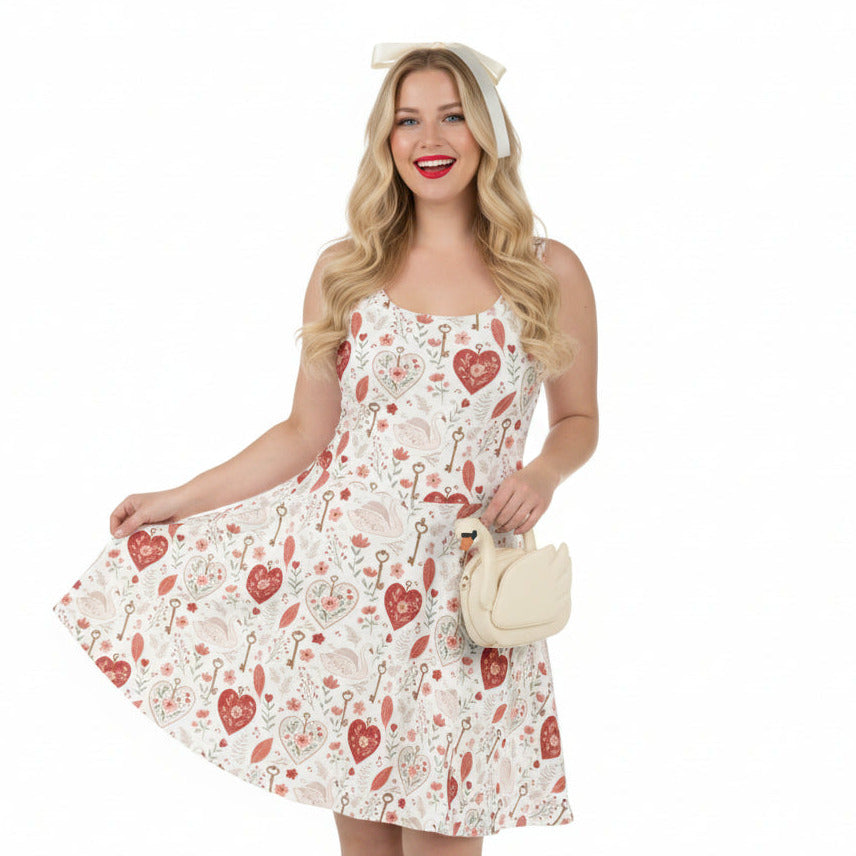 Woman wearing a white dress with red floral patterns on a white background
