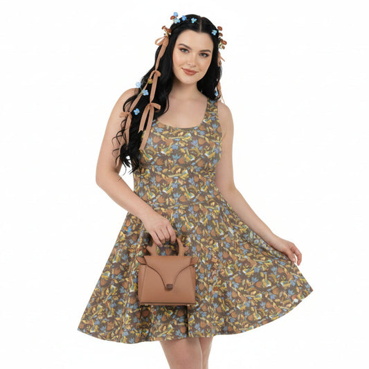 Woman wearing a floral dress holding a brown handbag on a white background