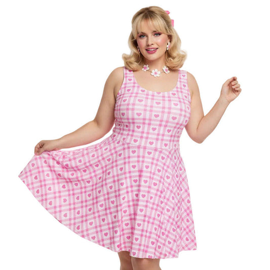 Plus size woman wearing pink and white gingham heart swing dress.