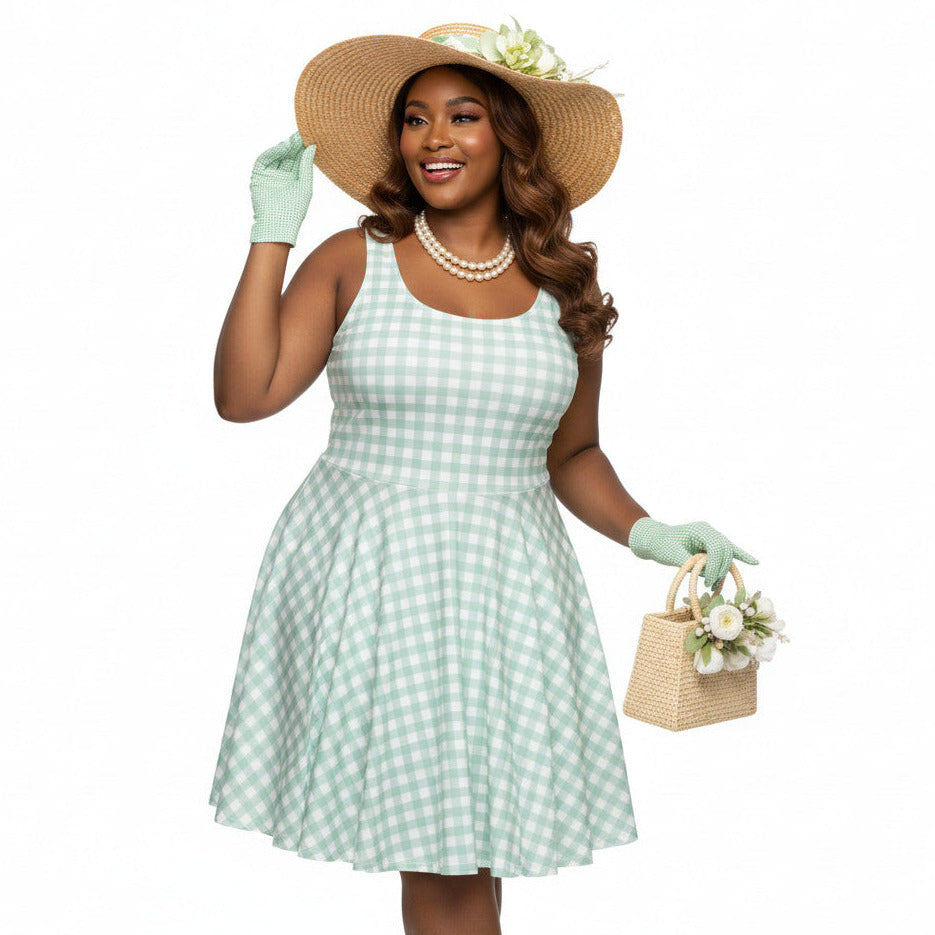 Plus size woman wearing a pastel green and white gingham 1950s vintage-style swing dress with a straw hat and gloves.