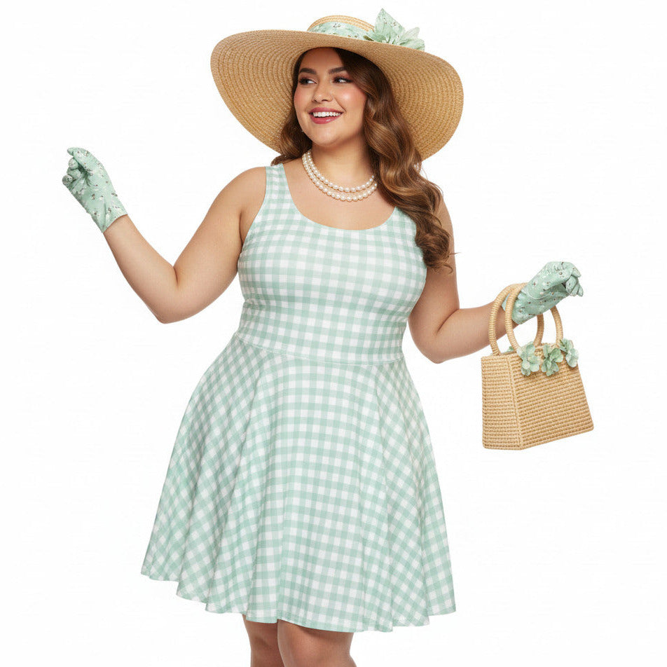 Plus size woman wearing a pastel green and white gingham 1950s vintage-style swing dress with a straw hat and gloves.