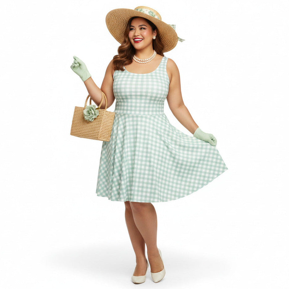 Plus size woman wearing a pastel green and white gingham 1950s vintage-style swing dress with a straw hat and gloves.