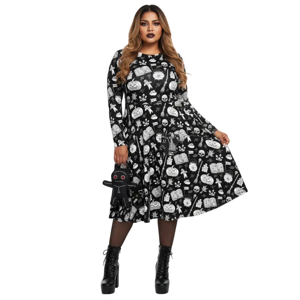 Woman wearing gothic long sleeve midi dress with black and white voodoo doll print and side pockets.