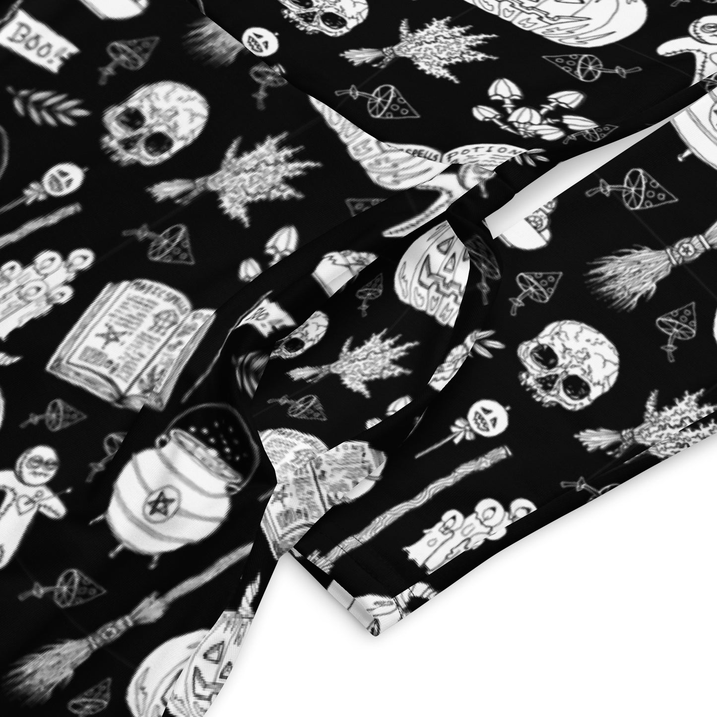 gothic long sleeve midi dress with black and white voodoo doll print and side pockets.