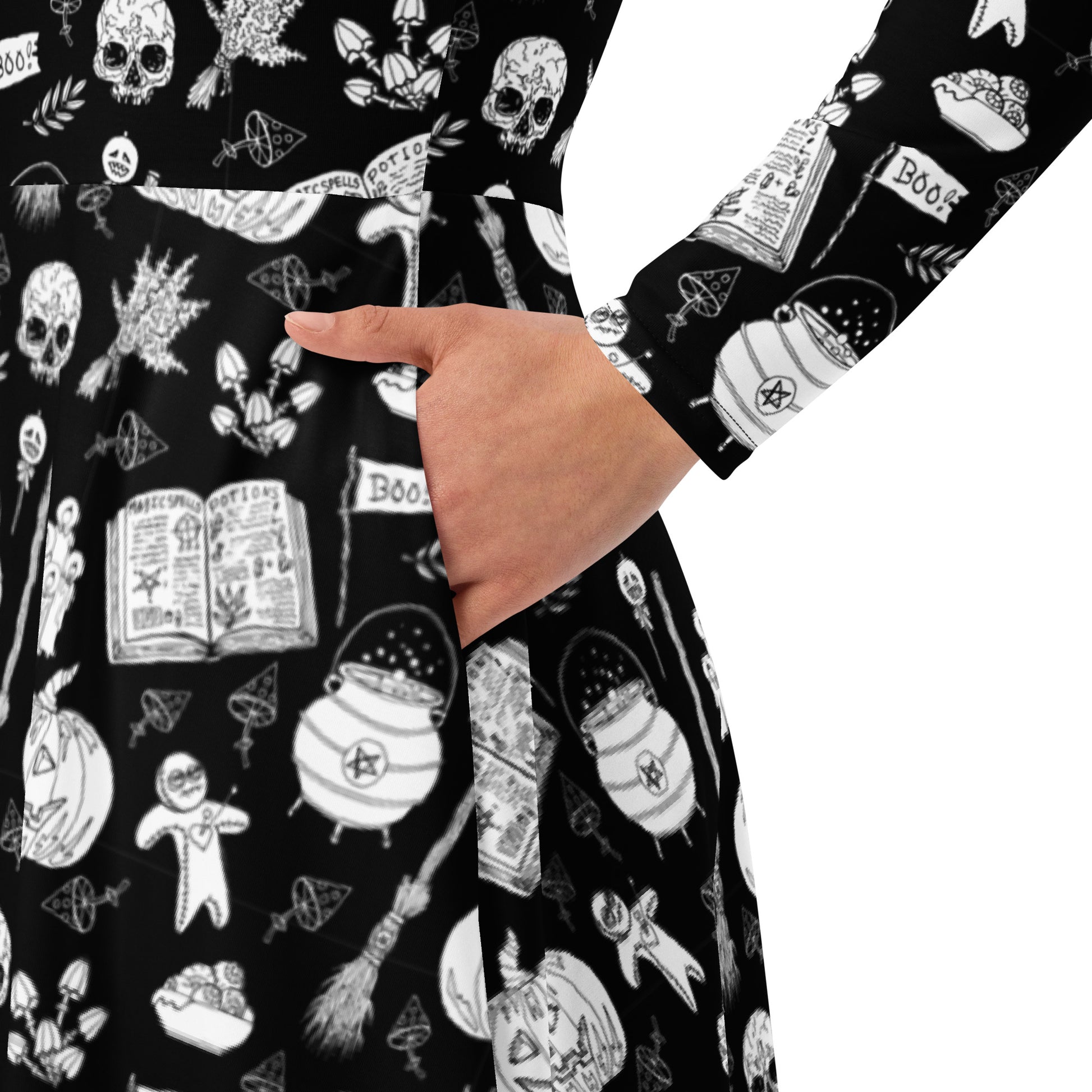 goth long sleeve midi dress with black and white voodoo doll print and side pockets.