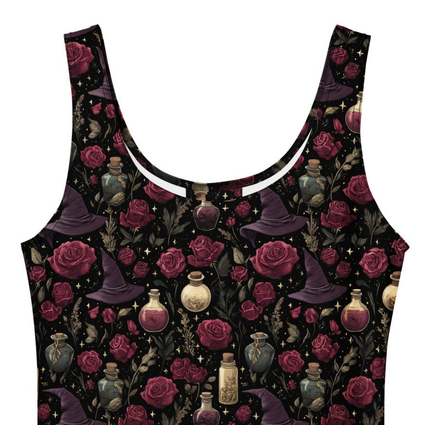 Black sleeveless dress with floral and witch hat pattern on a white background