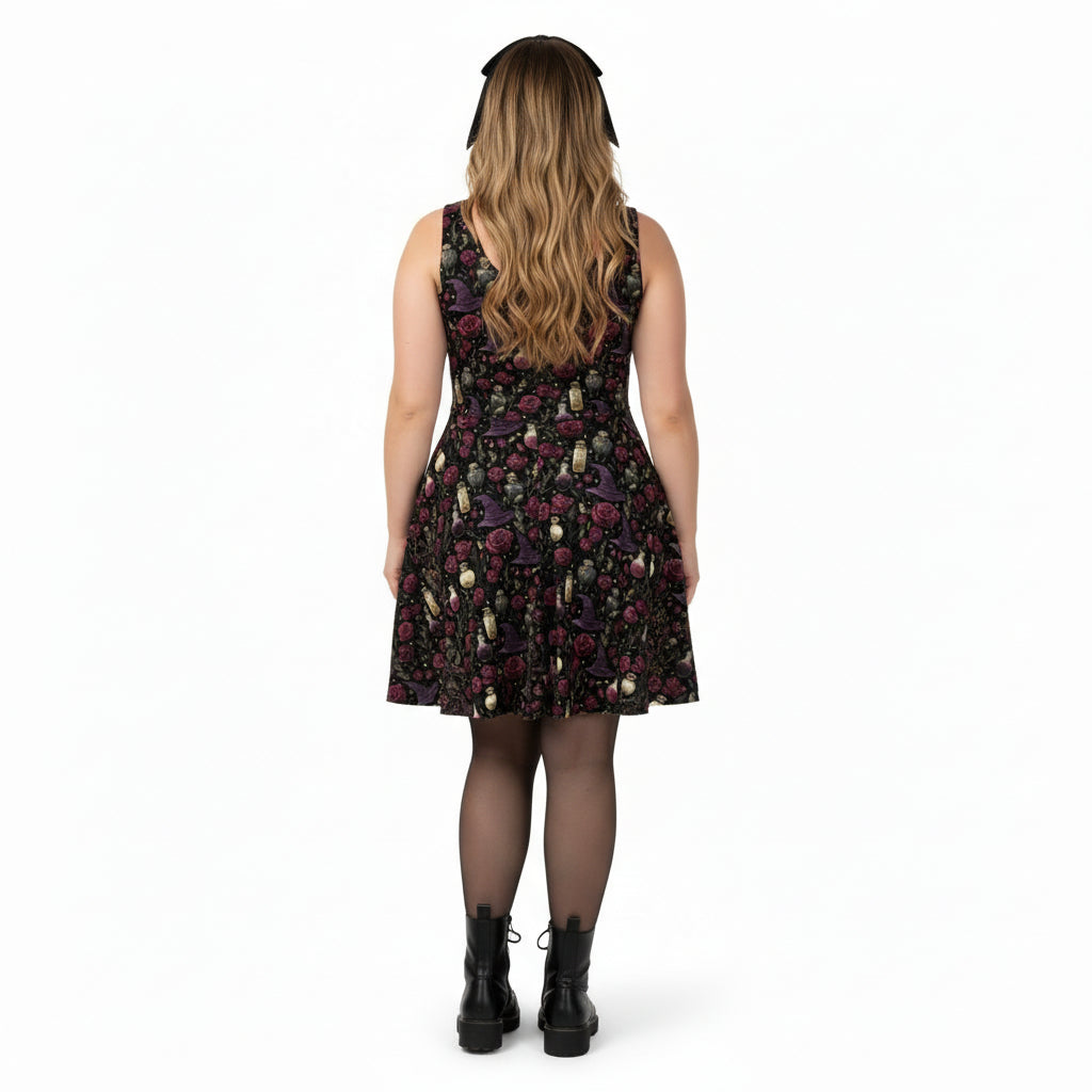 Woman wearing a black floral dress on a white background