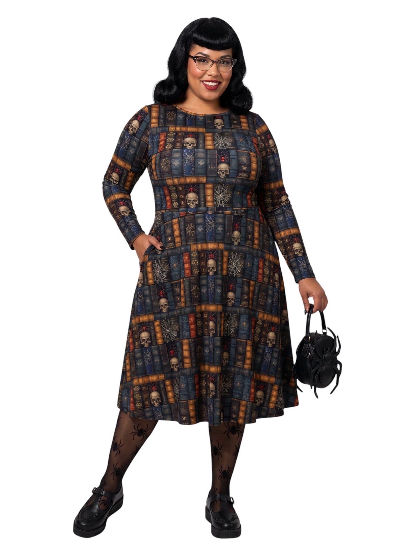 Plus-size model smiling in a Dark Academia midi dress featuring a bookshelf print with vintage books, skulls, and spiderwebs, designed with long sleeves and a fit-and-flare silhouette.