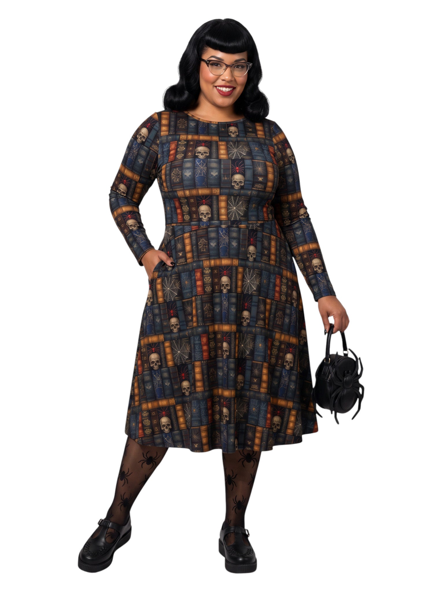 Plus-size model smiling in a Dark Academia midi dress featuring a bookshelf print with vintage books, skulls, and spiderwebs, designed with long sleeves and a fit-and-flare silhouette.