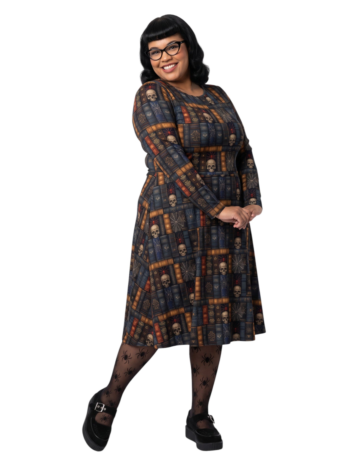 Plus-size model smiling in a Dark Academia midi dress featuring a bookshelf print with vintage books, skulls, and spiderwebs, designed with long sleeves and a fit-and-flare silhouette.