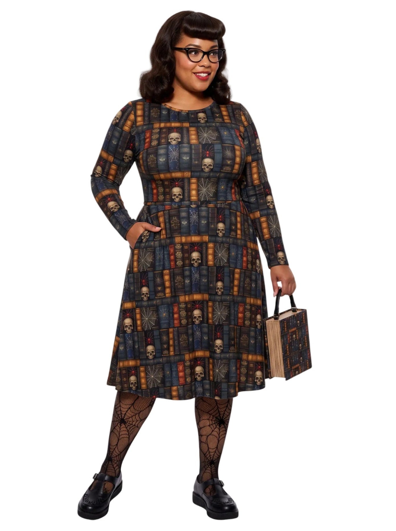 Plus-size model smiling in a Dark Academia midi dress featuring a bookshelf print with vintage books, skulls, and spiderwebs, designed with long sleeves and a fit-and-flare silhouette.