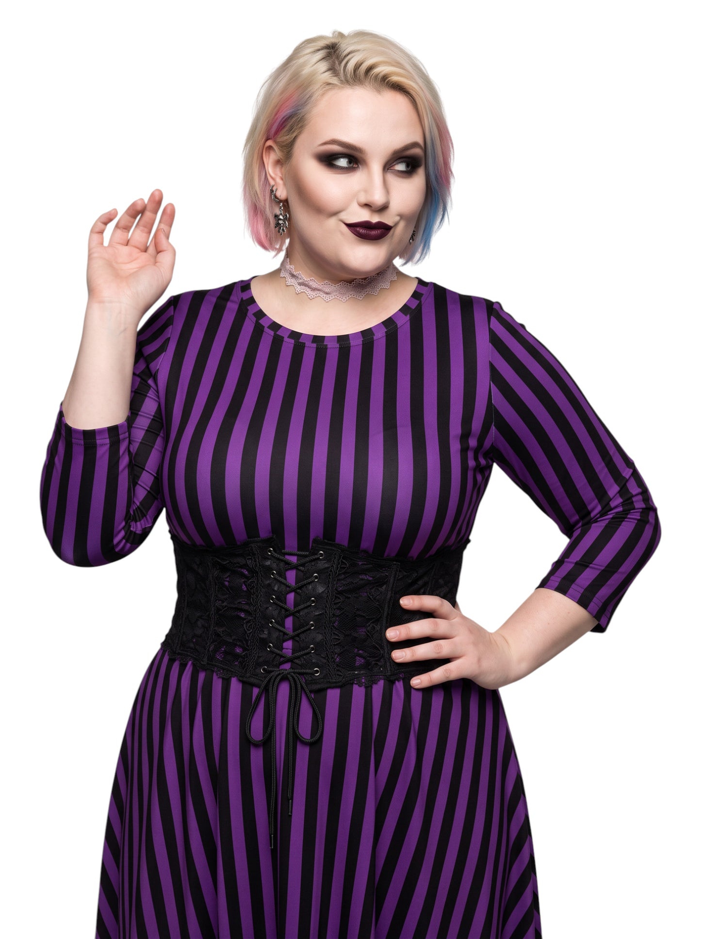 Plus size woman modeling gothic purple and black vertically striped long sleeve fit and flare midi dress with side pockets