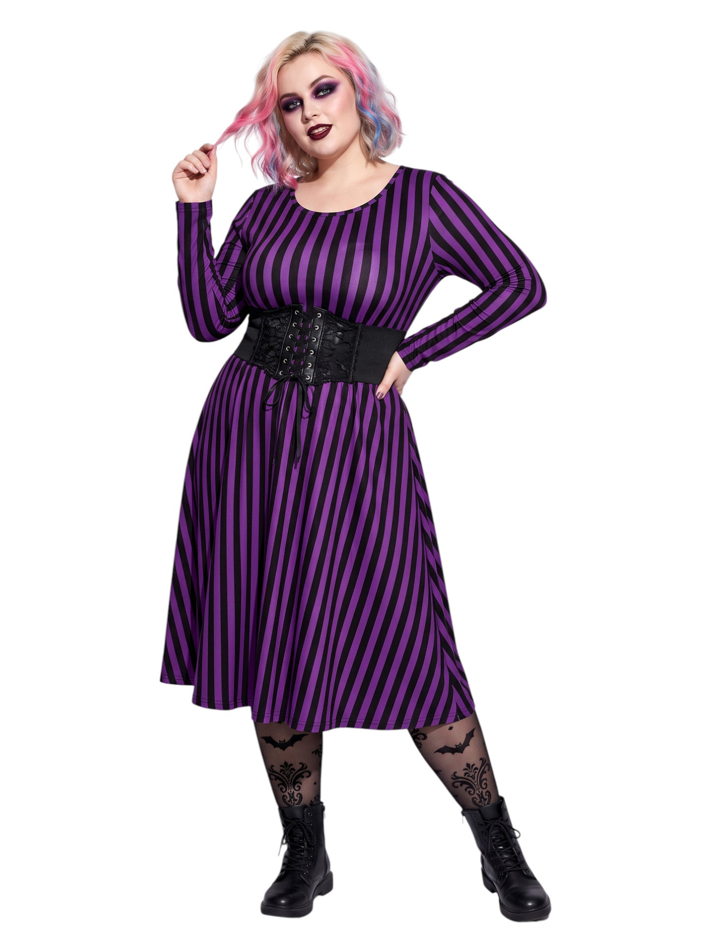 Plus size woman modeling gothic purple and black vertically striped long sleeve fit and flare midi dress with side pockets