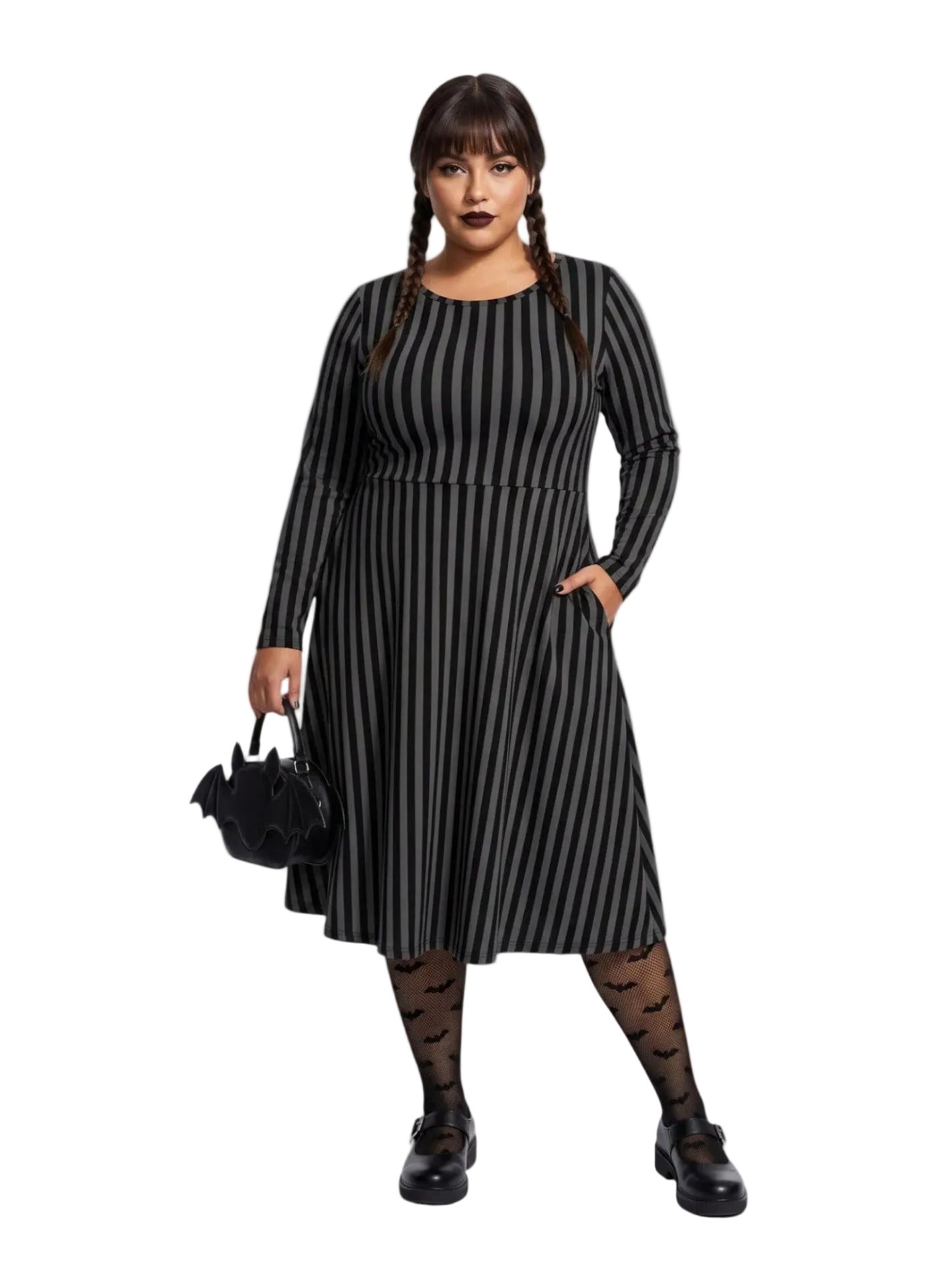 Plus size woman wearing a gothic grey and black vertically striped fit and flare midi dress with long sleeves, functional side pockets, and a scoop neckline.