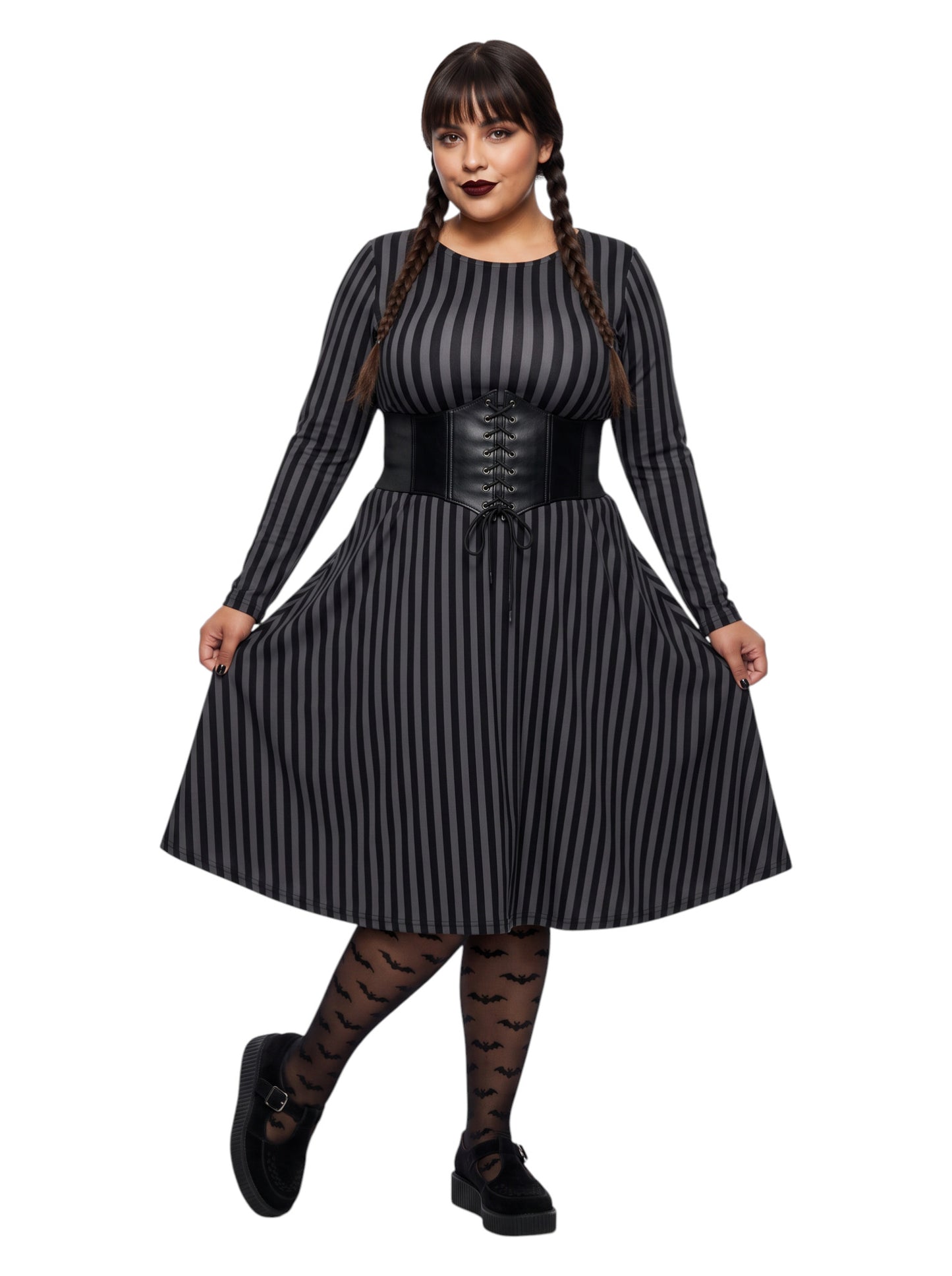 Plus size woman wearing a gothic grey and black vertically striped fit and flare midi dress with long sleeves, functional side pockets, and a scoop neckline.