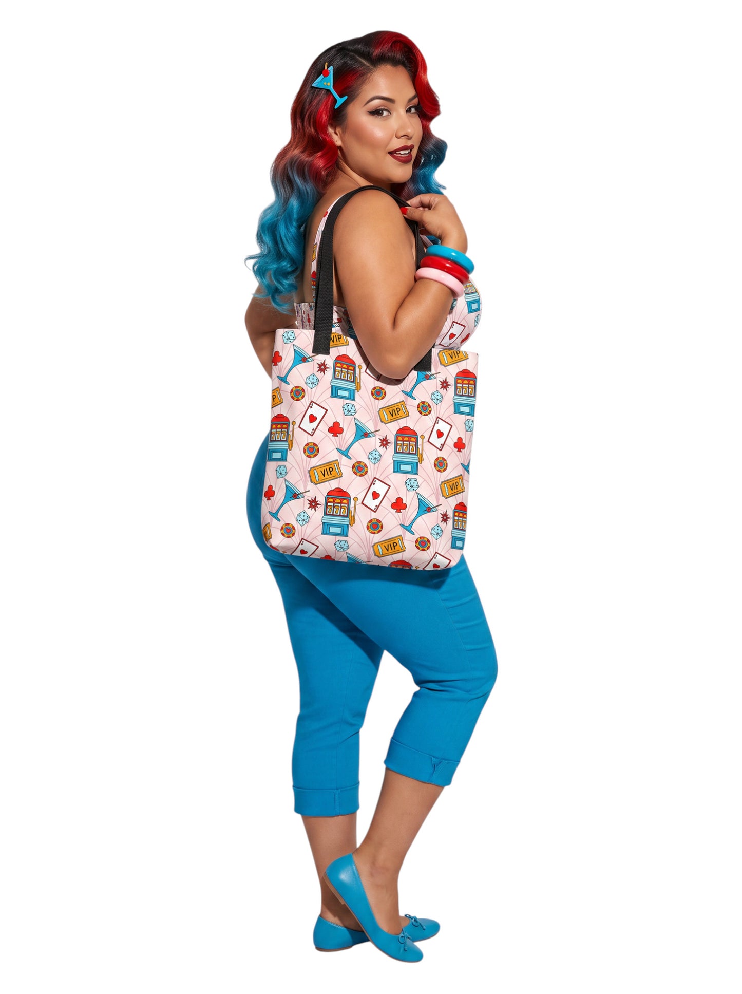 A woman wearing a martini Las Vegas Casino Pinup 1950s Rockabilly Tote Bag with retro slot machine and dice pattern.