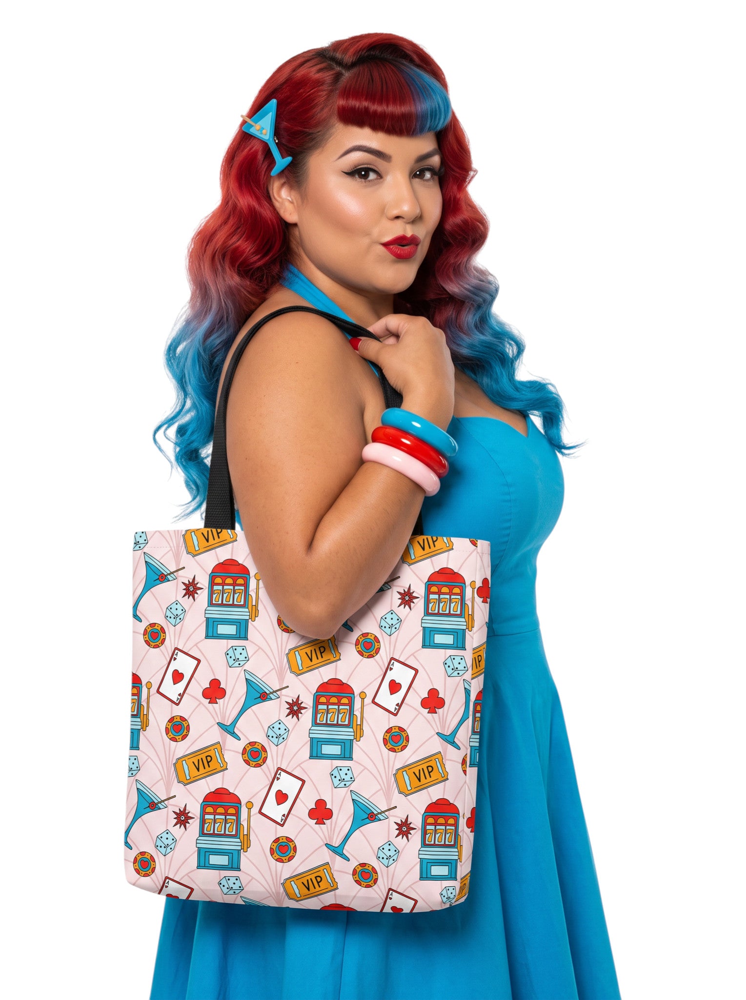 A woman wearing a martini Las Vegas Casino Pinup 1950s Rockabilly Tote Bag with retro slot machine and dice pattern.