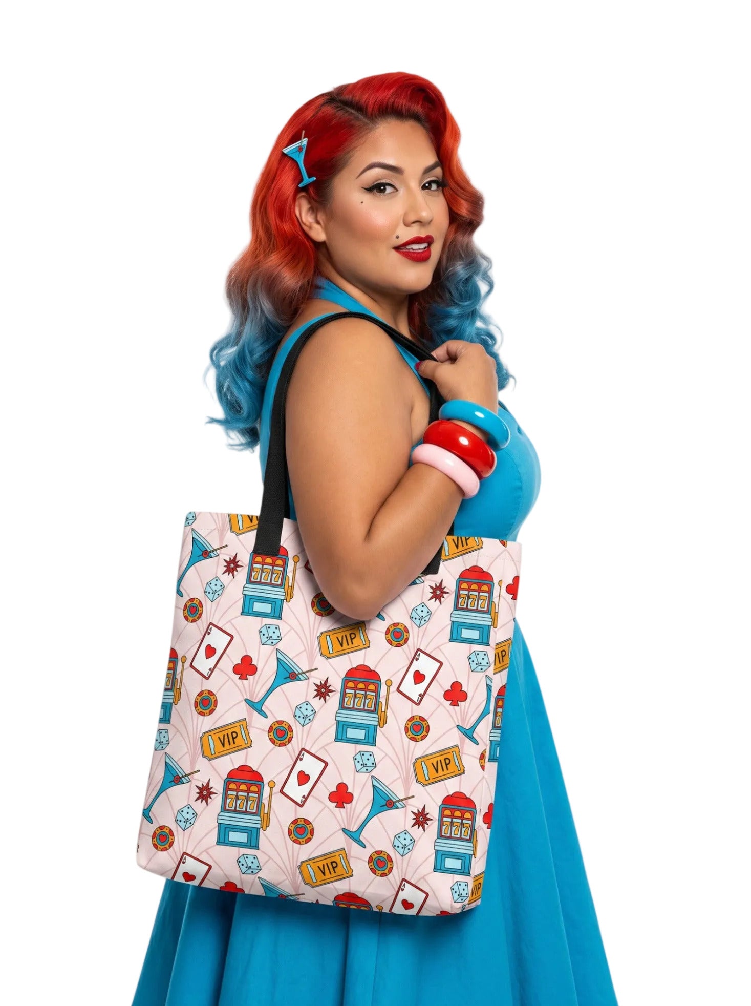 A woman wearing a martini Las Vegas Casino Pinup Tote Bag with retro slot machine and dice pattern.