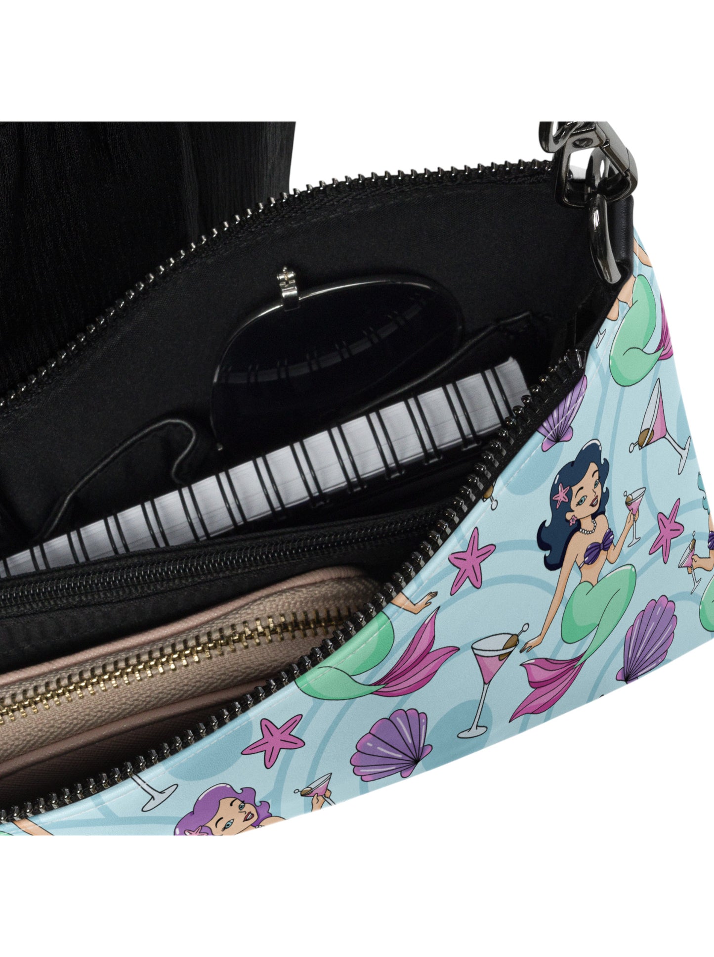 Mermaids, martinis and seashells convertible clutch and crossbody bag in faux leather with adjustable strap.