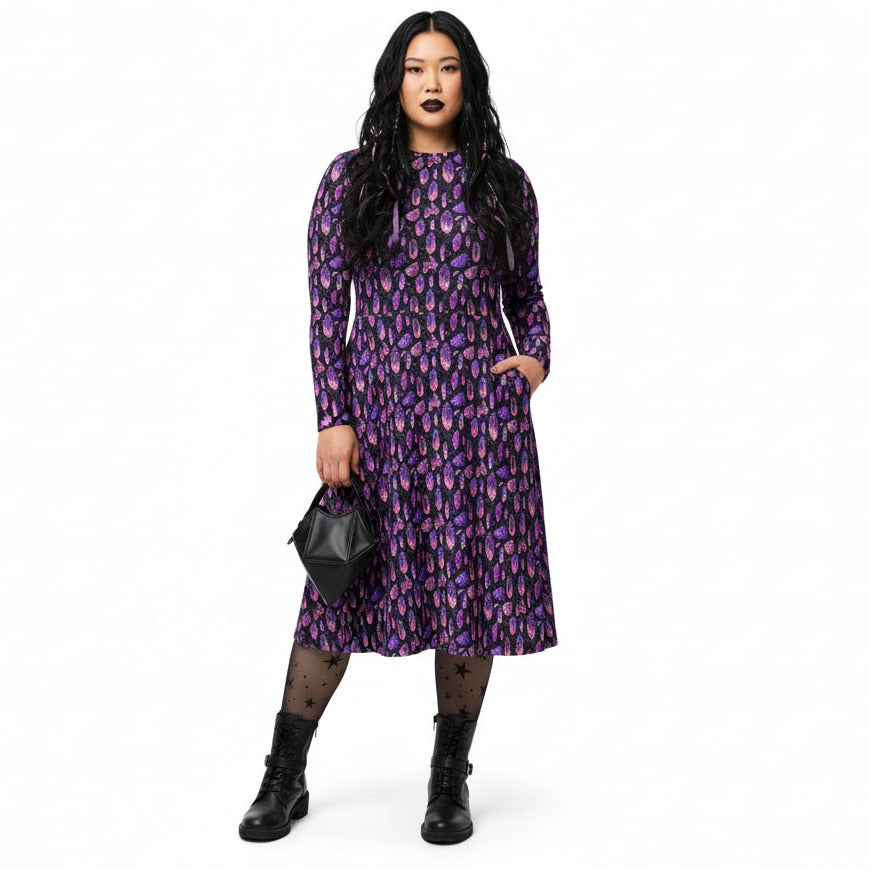 Woman wearing a purple crystal print  dress on a white background