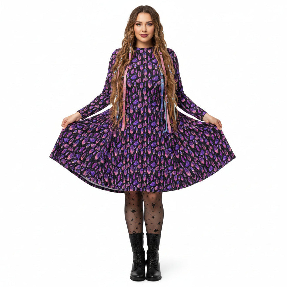 Woman wearing a purple crystal print  dress on a white background