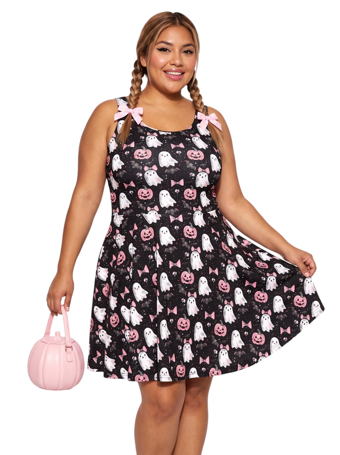 Plus size model wearing a pastel goth ghost skater dress featuring a cute pink bow and pumpkin pattern with a retro fit and flare silhouette.