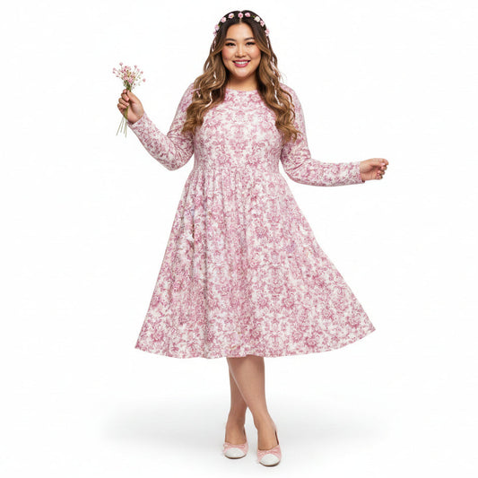 Woman wearing a pink floral dress on a white background