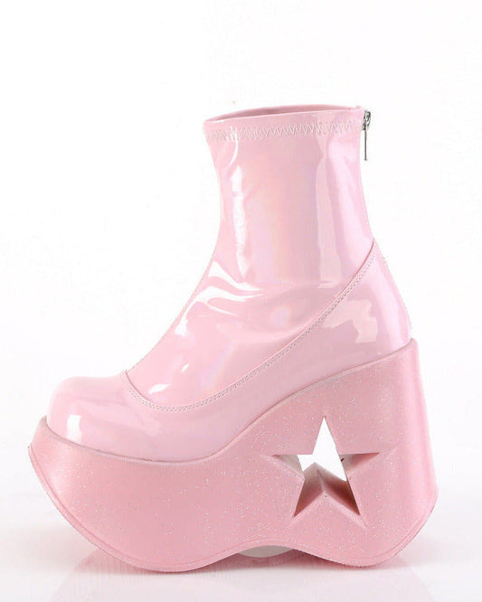 Pink holographic platform wedge ankle boot featuring a 5-inch star cutout in the heel and a back metal zip closure.