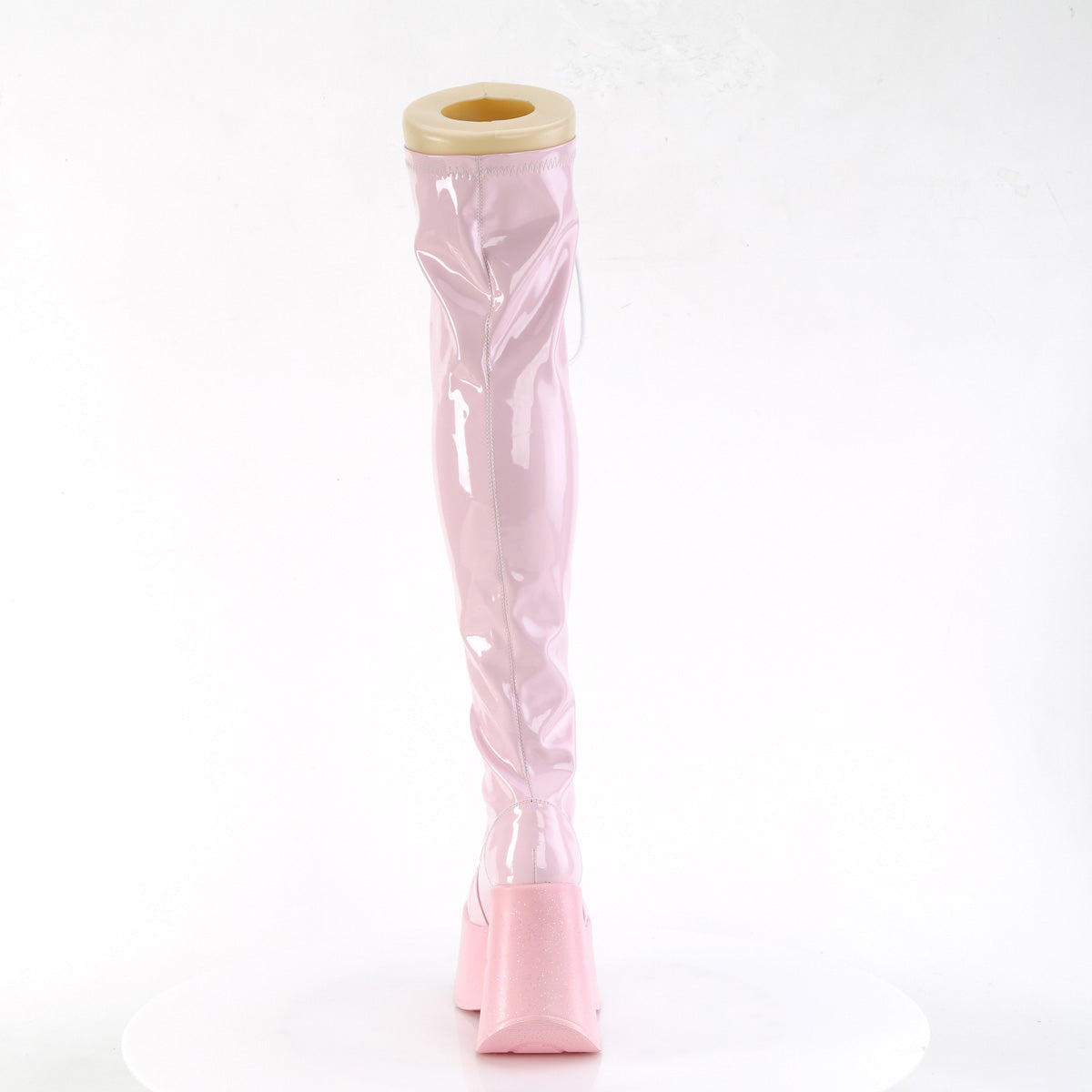 Pink holographic thigh-high platform wedge boots with star cutout and lace-up front