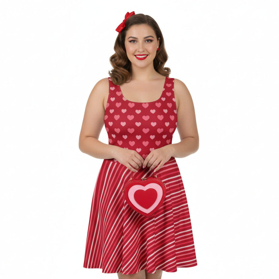 Woman wearing a red dress with heart patterns on a white background