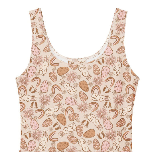 1950s vintage style swing dress with pink and tan Easter egg and bunny print, featuring a sleeveless scoop neck and flared skirt.