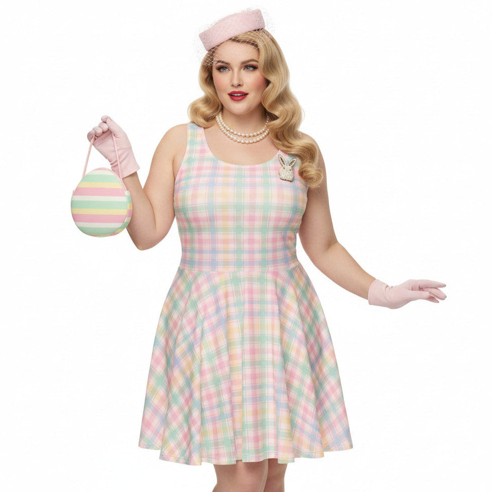 Plus size woman wearing a pastel pink and green gingham 1950s vintage style swing dress with matching pillbox hat and gloves.