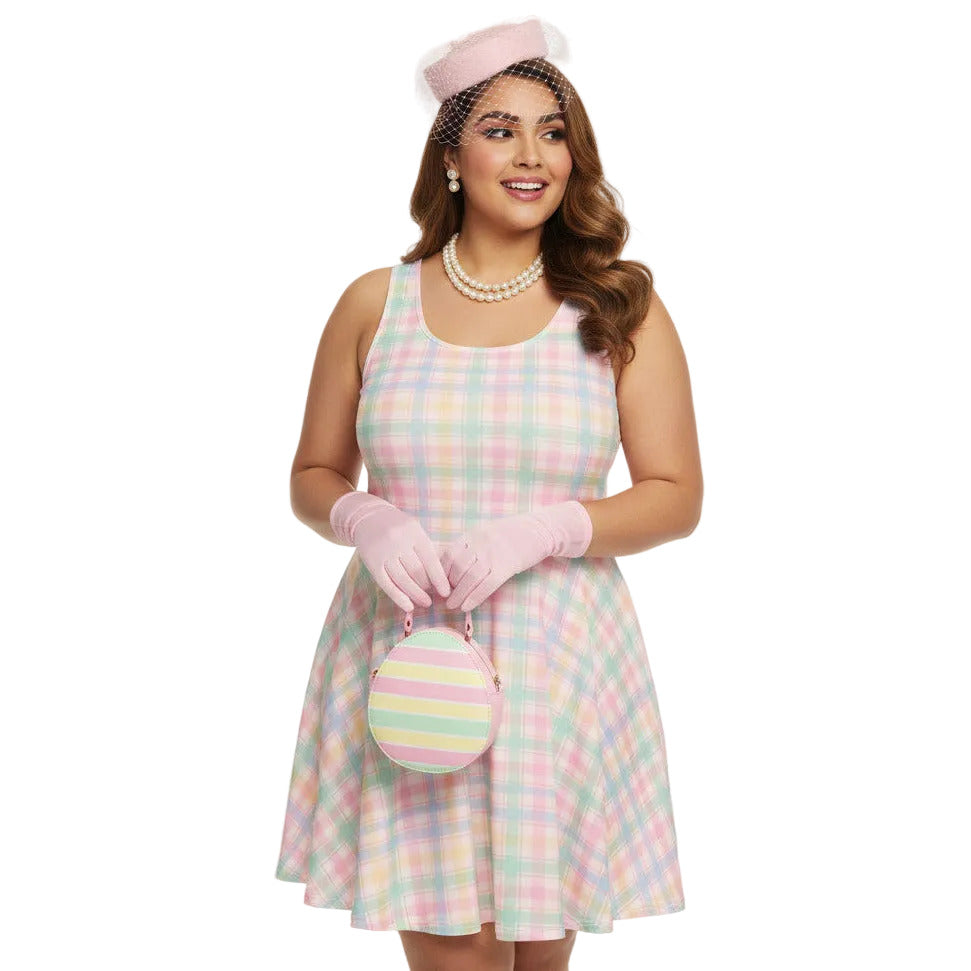 Plus size woman wearing a pastel pink and green gingham 1950s vintage style swing dress with matching pillbox hat.