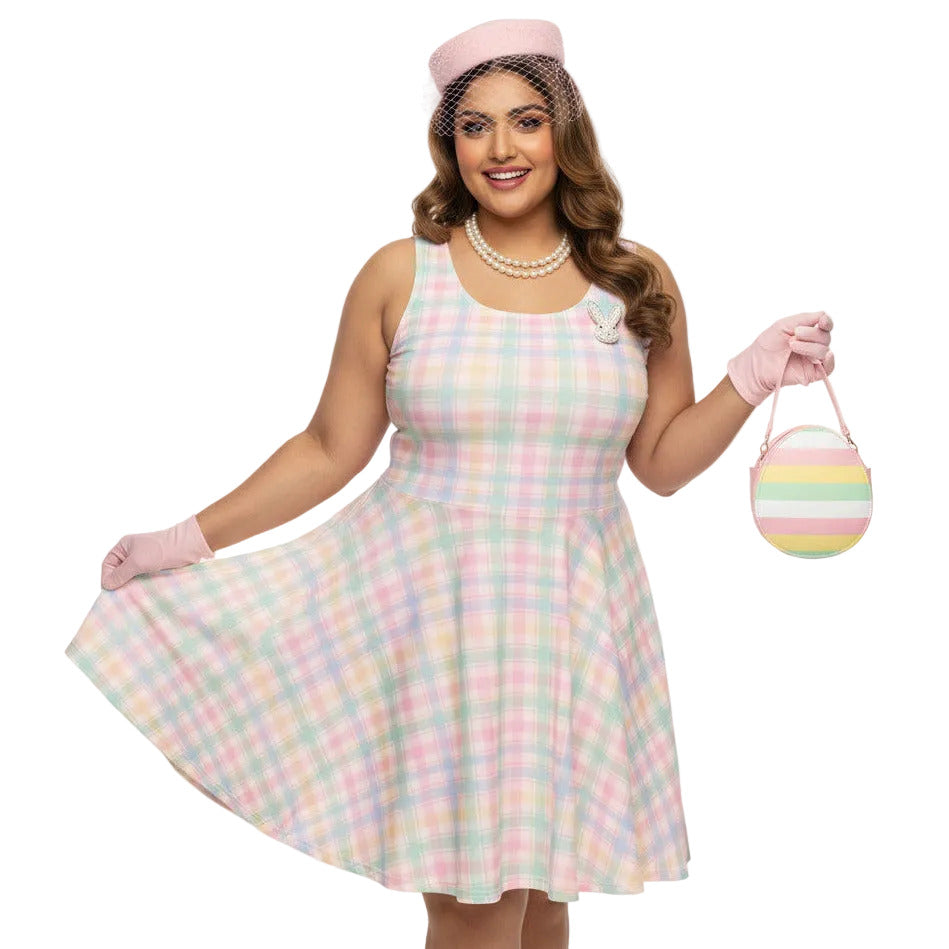 Plus size woman wearing a pastel pink and green gingham 1950s vintage style swing dress with matching pillbox hat.