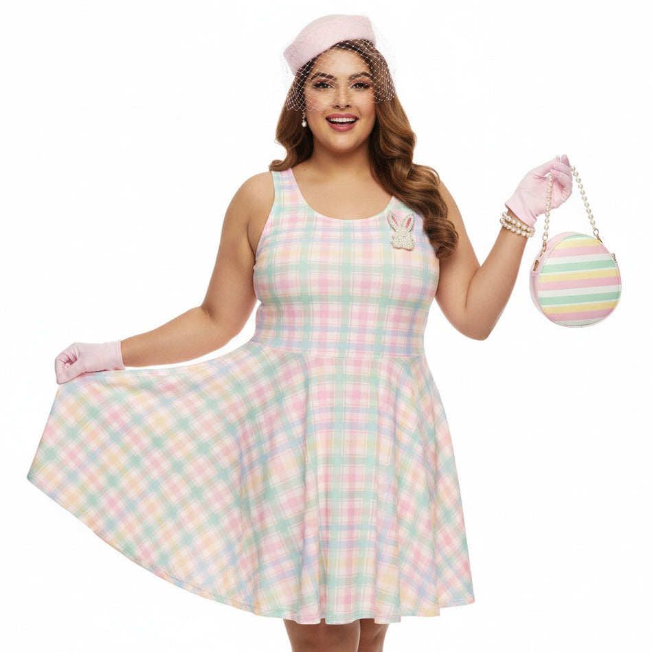 Plus size woman wearing a pastel pink and green gingham 1950s vintage style swing dress with matching pillbox hat.