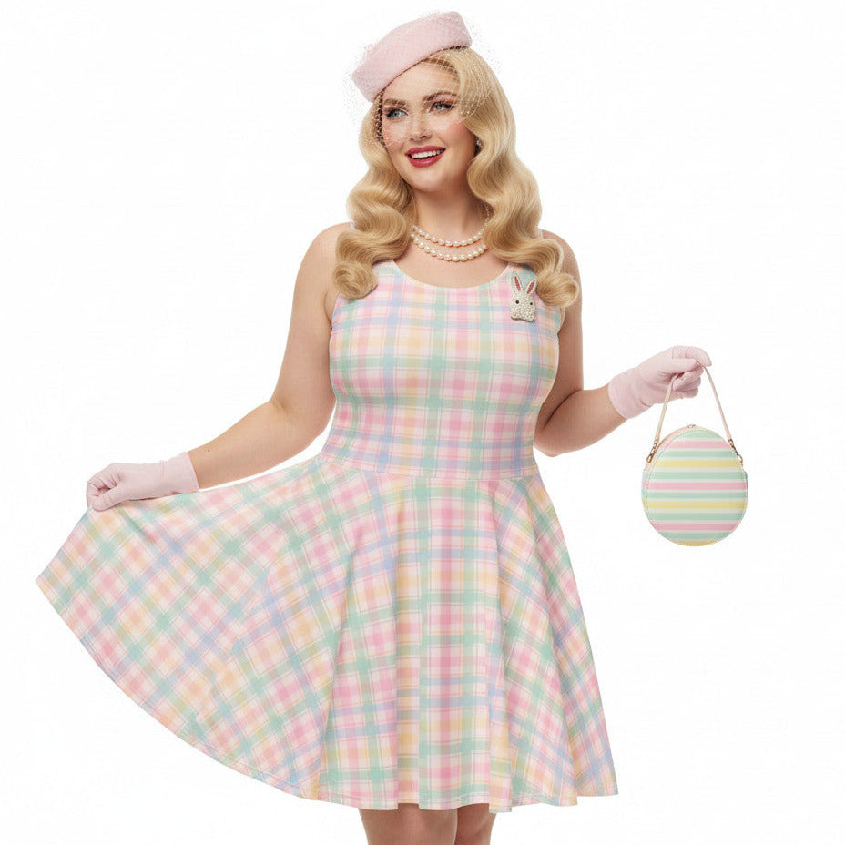 Plus size woman wearing a pastel pink and green gingham 1950s vintage style swing dress with matching pillbox hat.